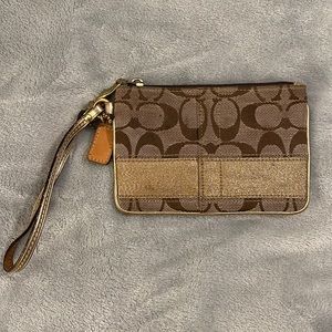 Used Condition Tan and Gold/Sparkle Coach Wristlet